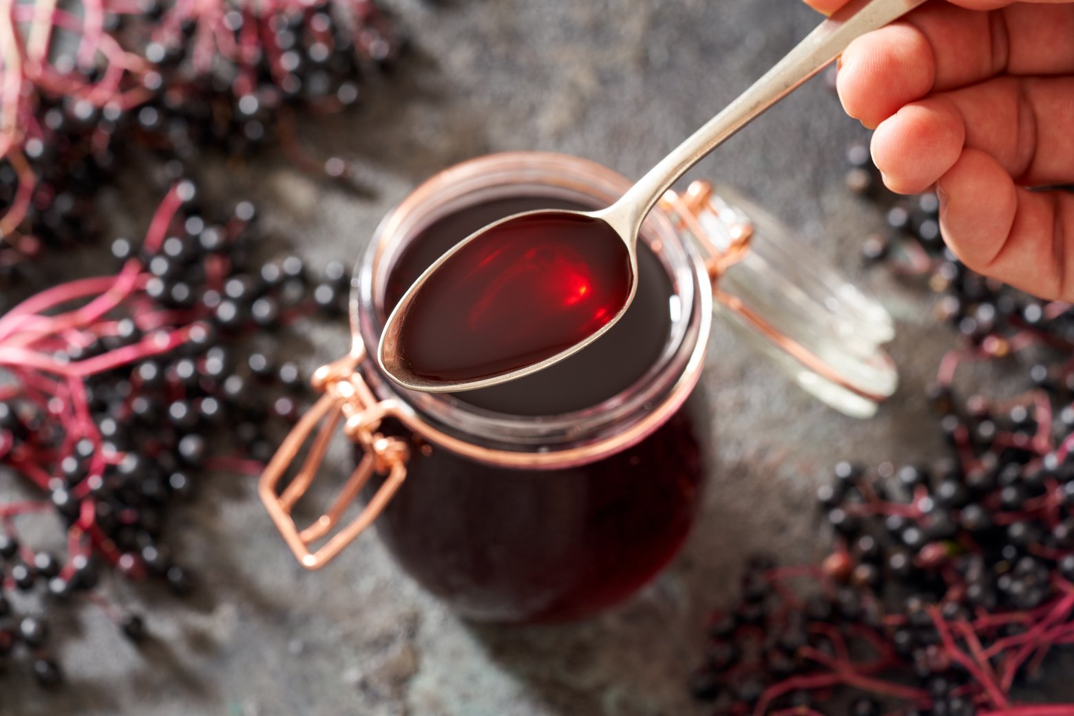 Spoon with Black Elder Syrup Made from Fresh Elderberries